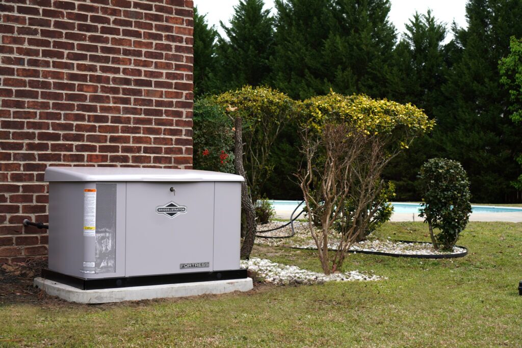 Whole-home generator installed outside of a red brick building